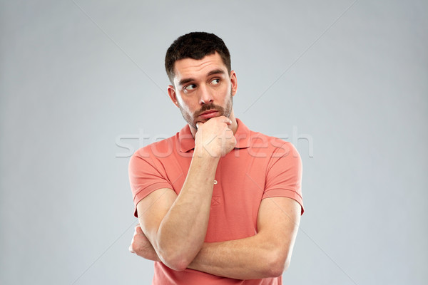 man thinking over gray background Stock photo © dolgachov