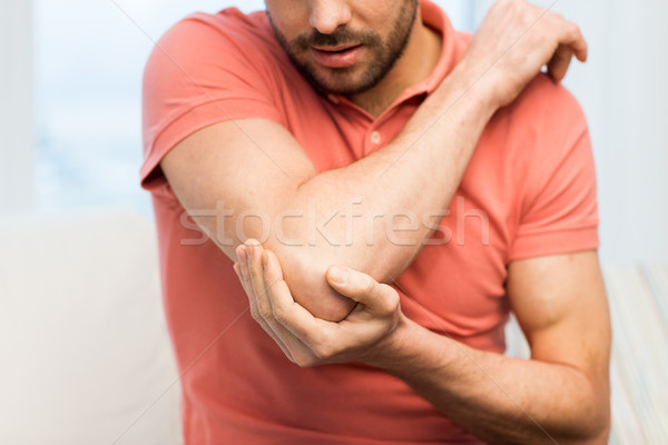 close up of man with injured hand at home Stock photo © dolgachov
