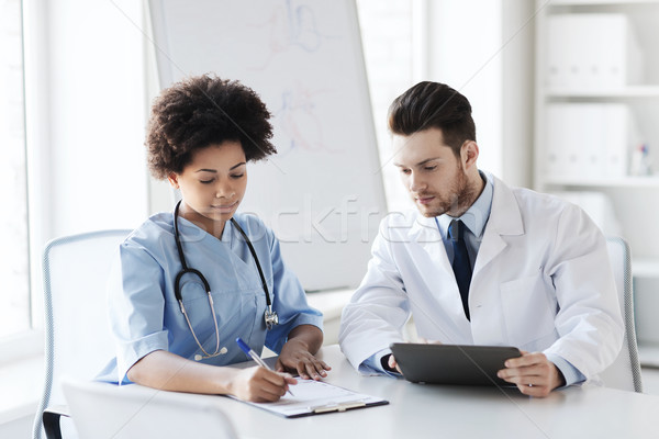 two doctors meeting at hospital office Stock photo © dolgachov