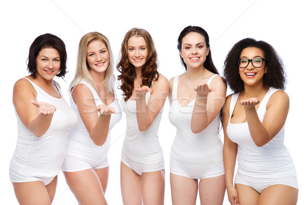 Grup fericit diferit femei sufla Imagine de stoc © dolgachov