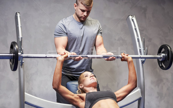 Hombre mujer barra con pesas músculos gimnasio deporte Foto stock © dolgachov