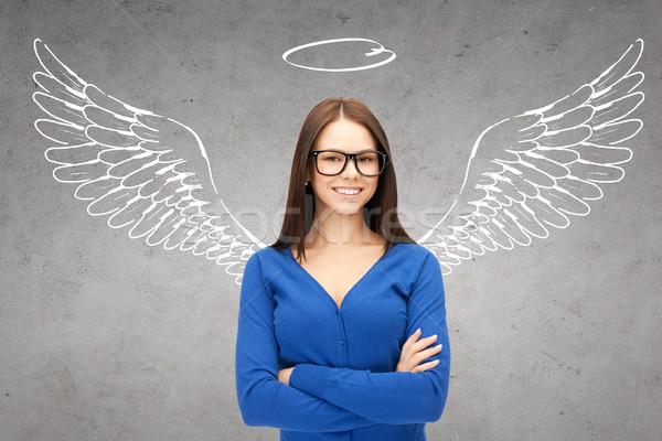 Stock photo: happy businesswoman with angel wings and nimbus