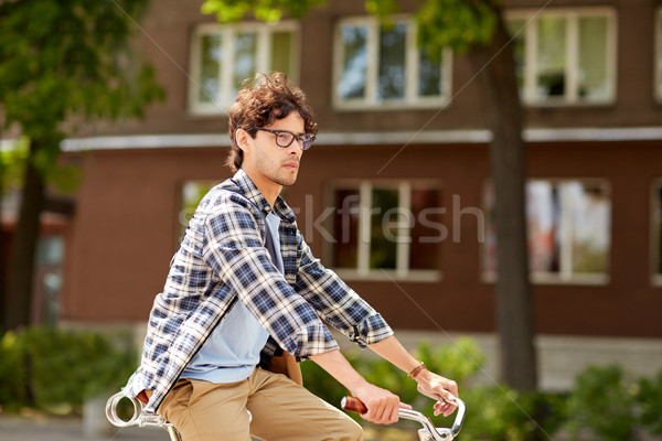 Jeunes homme sac équitation fixé [[stock_photo]] © dolgachov