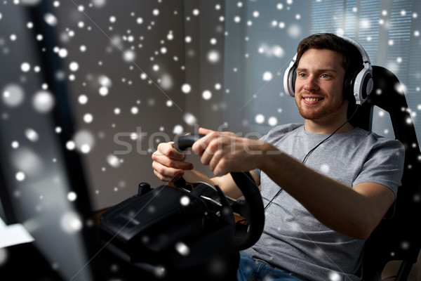 Homme jouer voiture course jeu vidéo maison [[stock_photo]] © dolgachov