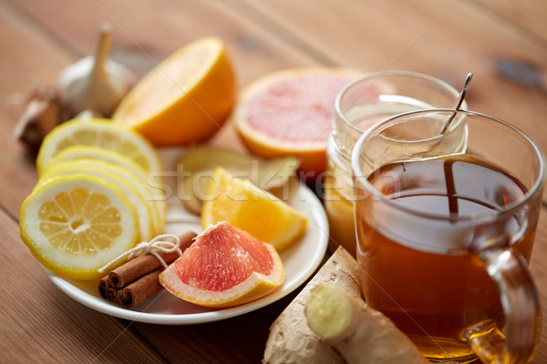 ginger tea with honey, citrus and garlic on wood Stock photo © dolgachov