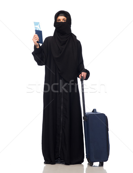 muslim woman with ticket, passport and travel bag Stock photo © dolgachov
