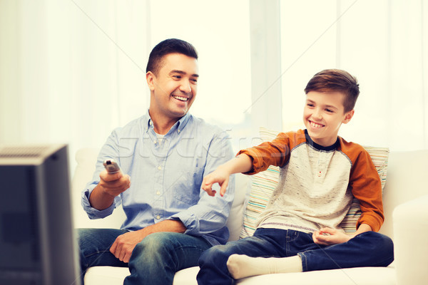 Souriant père en fils regarder tv maison famille [[stock_photo]] © dolgachov