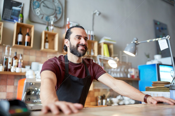 happy man or waiter at bar or coffee shop Stock photo © dolgachov