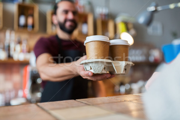 Stock photo: man or bartender serving customer at coffee shop