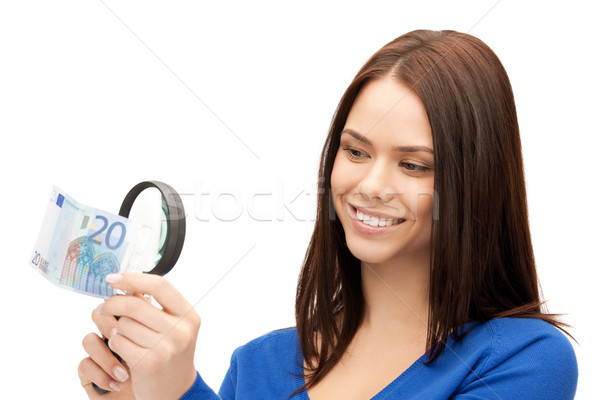 woman with magnifying glass and euro cash money Stock photo © dolgachov