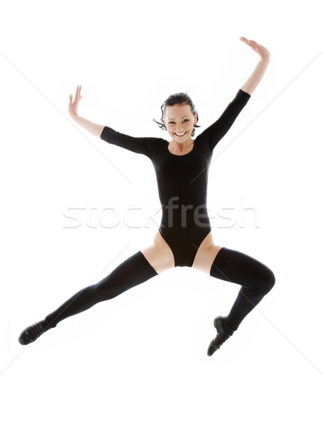 jumping girl in black leotard Stock photo © dolgachov