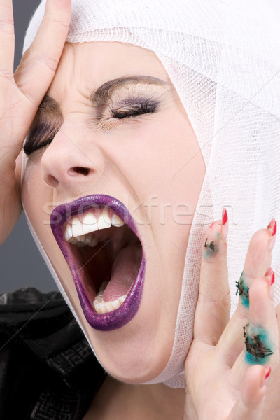 Lesioni foto urlando ferito volto di donna grigio Foto d'archivio © dolgachov