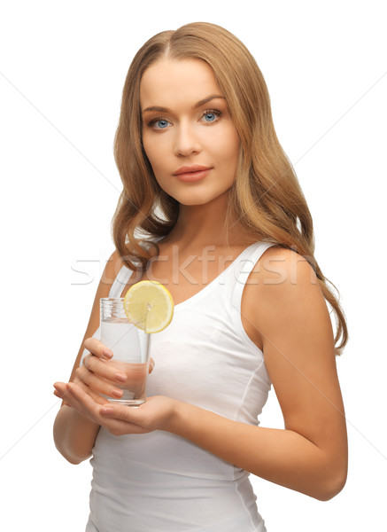 woman with lemon slice on glass of water Stock photo © dolgachov