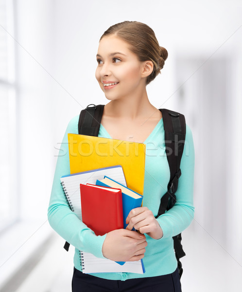 student with books and schoolbag Stock photo © dolgachov