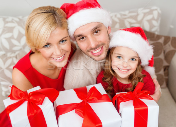 smiling family holding many gift boxes Stock photo © dolgachov