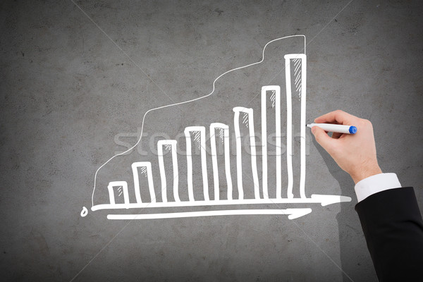 close up of businessman drawing growing graph Stock photo © dolgachov