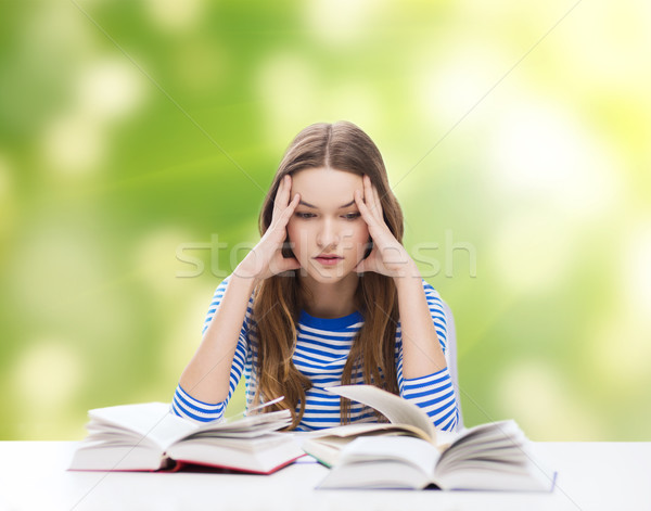 stressed student girl with books Stock photo © dolgachov