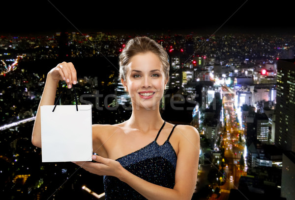 Stock photo: smiling woman with white blank shopping bag