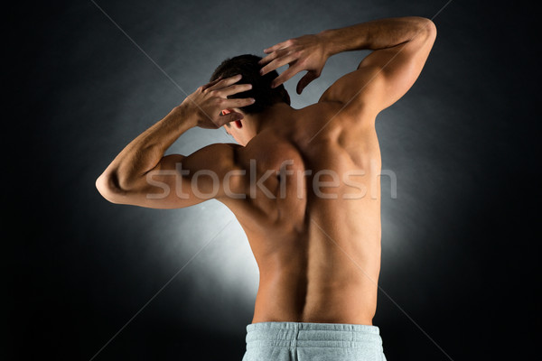 young male bodybuilder from back Stock photo © dolgachov