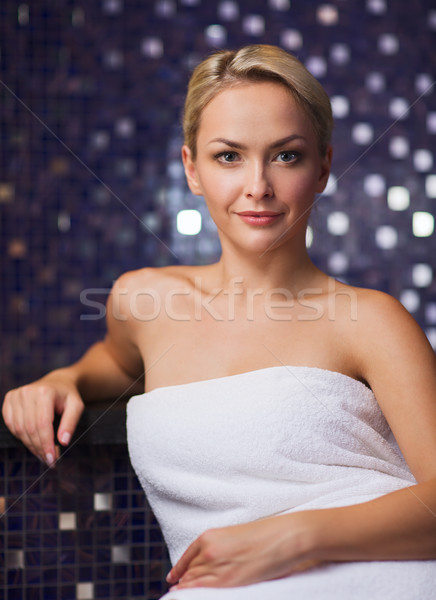 beautiful young woman sitting in bath towel Stock photo © dolgachov