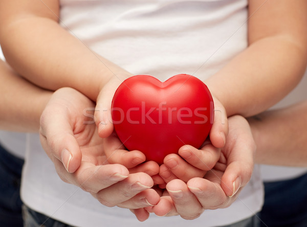 close up of woman and girl hands holding heart Stock photo © dolgachov