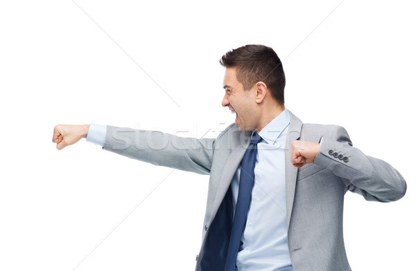 businessman in suit fighting with someone Stock photo © dolgachov
