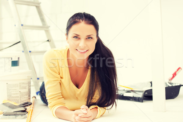 Stock photo: lovely housewife making repairing works