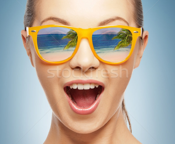 amazed girl in shades Stock photo © dolgachov