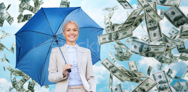 happy young businesswoman with umbrella outdoors Stock photo © dolgachov