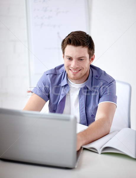 high school student with laptop in classroom Stock photo © dolgachov