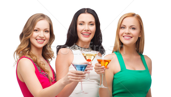 Três sorridente mulheres cocktails festa celebração Foto stock © dolgachov
