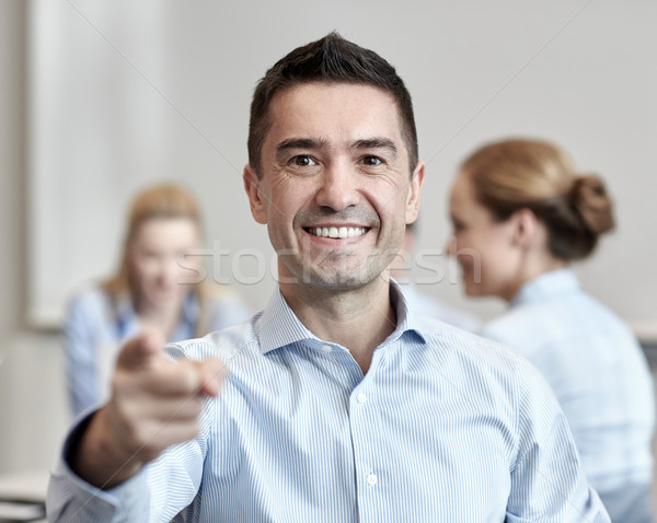 Stock photo: group of smiling businesspeople meeting in office