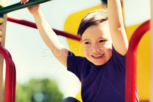 快樂 小 男孩 攀登 孩子 操場 商業照片 © dolgachov