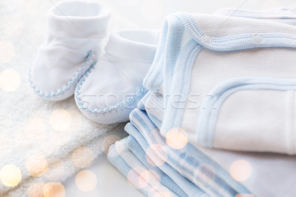 Stock photo: close up of baby boys clothes for newborn on table