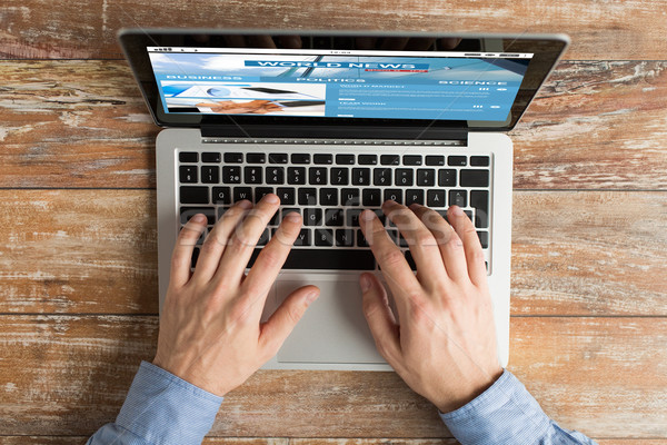 close up of male hands with laptop typing Stock photo © dolgachov