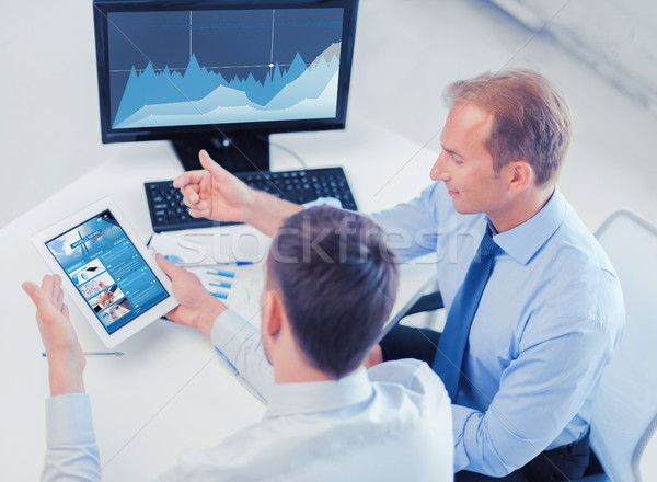 businessmen with tablet pc and computer at office Stock photo © dolgachov