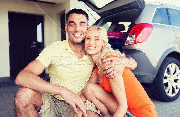 happy couple hugging at home car parking space Stock photo © dolgachov