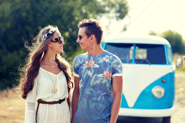 Stock photo: smiling young hippie couple over minivan car