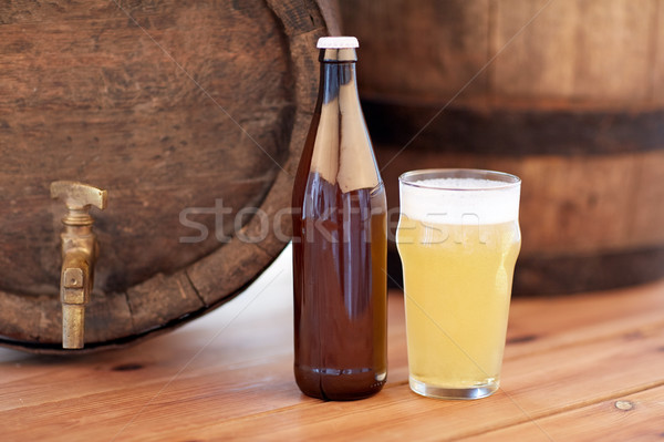 Stock photo: close up of old beer barrel, glass and bottle