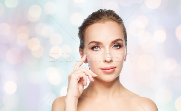 beautiful young woman showing her cheekbone Stock photo © dolgachov