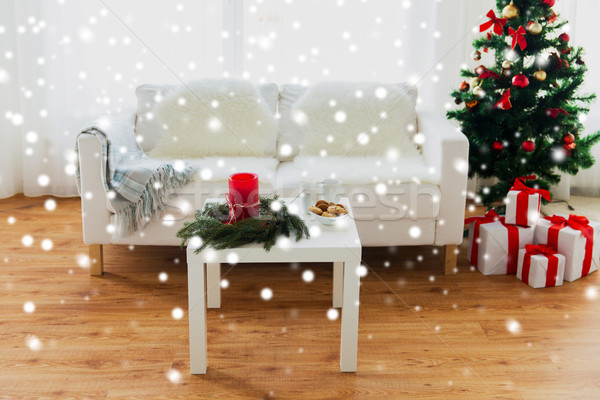 Stock photo: sofa, table and christmas tree with gifts at home