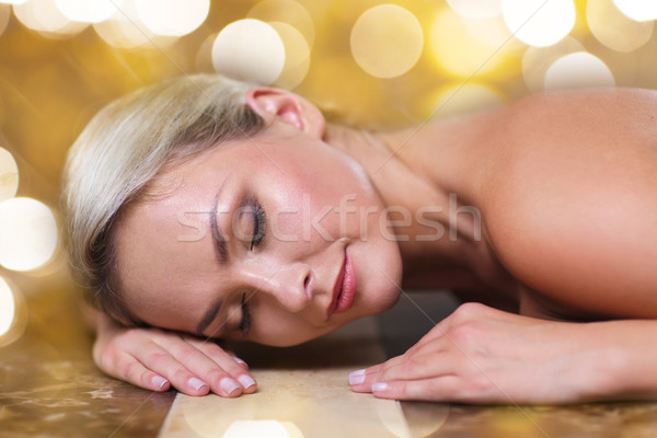 young woman lying on hammam table in turkish bath Stock photo © dolgachov