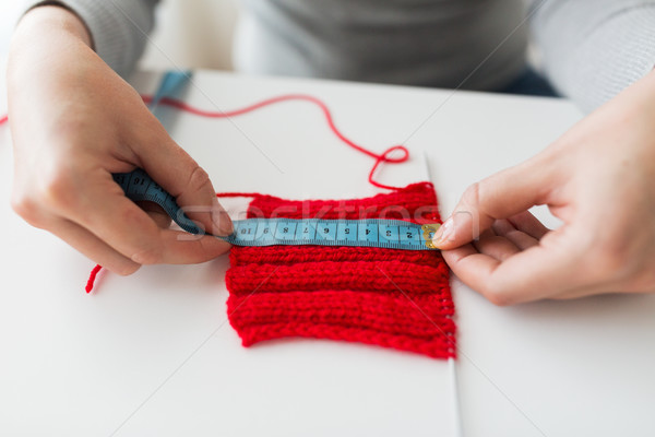 woman with knitting on needle and measuring tape Stock photo © dolgachov