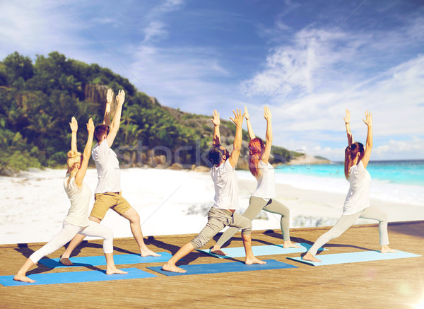 Groupe de gens yoga plage fitness sport [[stock_photo]] © dolgachov