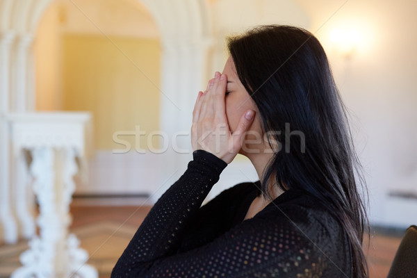 unhappy crying woman at funeral in church Stock photo © dolgachov
