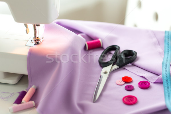 sewing machine, scissors, buttons and fabric Stock photo © dolgachov