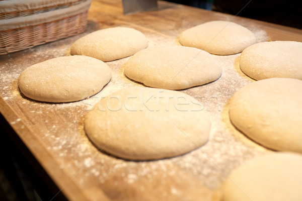 yeast bread dough on bakery kitchen table Stock photo © dolgachov