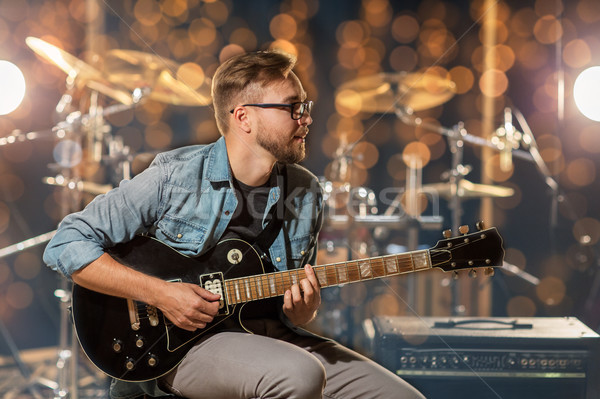musician playing guitar at studio or music concert Stock photo © dolgachov