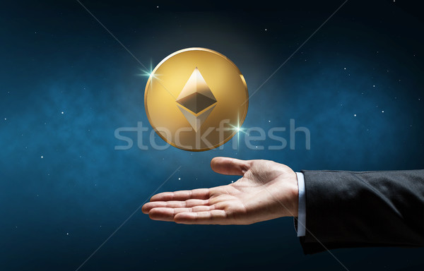 businessman hand with etherum over space Stock photo © dolgachov