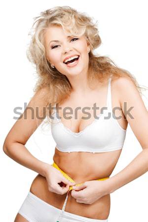 Fiatal gyönyörű nő mérőszalag fehér nő test Stock fotó © dolgachov